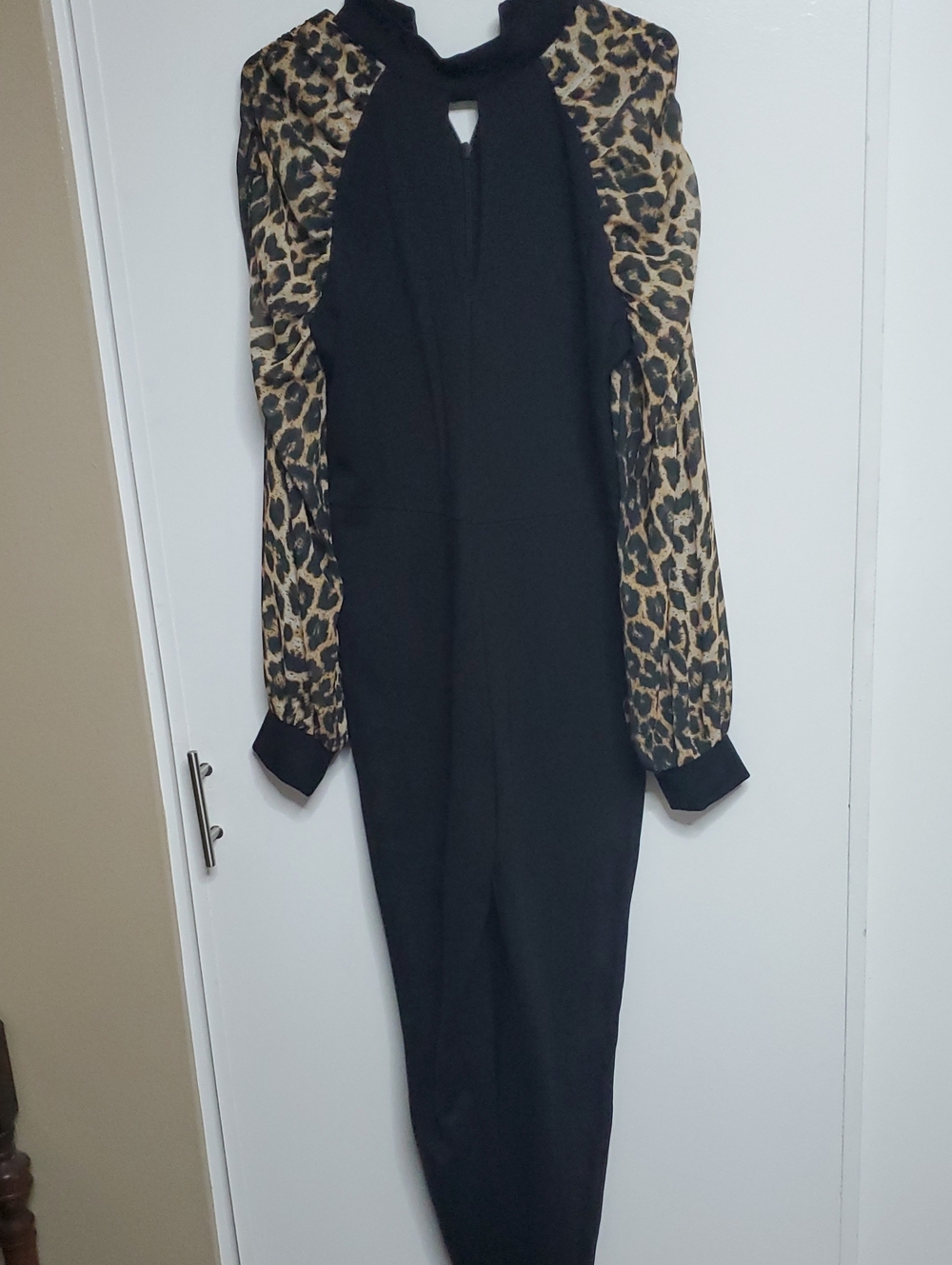 bebe Black Knit Jump Suit with Animal Print Sleeves. Stretch.